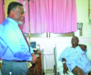 Prime Minister Samuel Hinds, performing the duties of president, sharing a light moment with People’s National Congress (PNC) General Secretary Oscar Clarke at the Georgetown Public Hospital Corporation (GPHC)