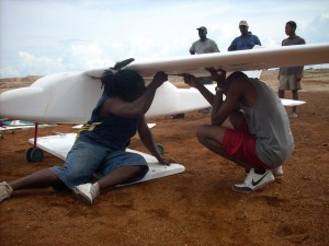 Roberts (left) working on one of his model planes