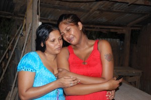 The baby’s mother being consoled by her grandmother