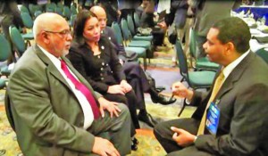 The Guyanese delegation, led by President Donald Ramotar, meets with Surinam Airways Vice President Clyde Cairo on the sidelines of the 24th Inter-sessional Meeting of Caricom Heads in Haiti. Also in photo are Home Affairs Minister Clement Rohee and Foreign Affairs Minister Carolyn Rodrigues-Birkett