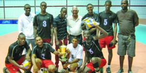 The Port Mourant Training Centre (PMTC) volleyball team poses with the GVF president after winning the Lenny Shuffler Challenge trophy last Sunday