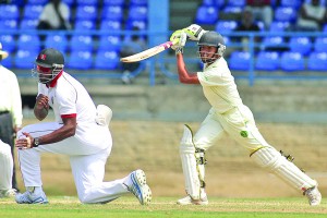 Kieron Pollard takes evasive action as Tagenarine Chanderpaul drives down the ground during the Guyana versus Trinidad and Tobago game last week