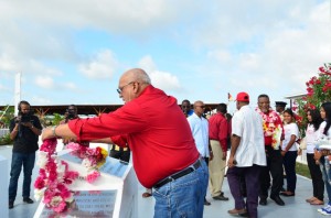 President Donald Ramotar lays a wreath in honour of the late President, Dr Cheddi Jagan at a Babu John memorial on Sunday