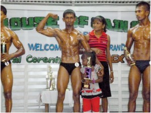 Leon Mahadeo poses with family members and his trophy