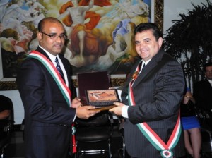 Former President Bharrat Jagdeo receiving the 'Order of Merit' from the governor of the State of Roraima, Jose de Achieta Junior