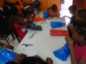 Children with their school supplies from HUG