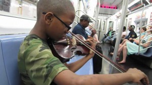 Claudius playing on the train in the U.S.