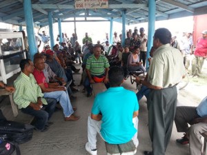 Minister within the Agriculture Ministry, Alli Baksh addressing farmers at the Hampton Court meeting