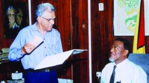 Taking the oath of office before Prime Minister Samuel Hinds