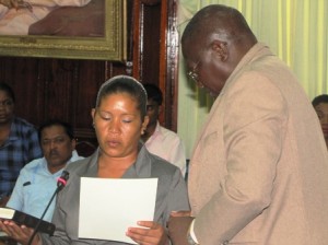 Newest Member of Parliament for A Partnership for National Unity and representing Region One (Barima/Waini), Renita Williams being sworn in by the Clerk of the National Assembly Sherlock Isaacs.