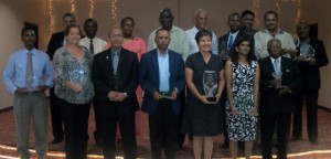 Public Works Minister Robeson Benn (fourth left in back row) with the pioneers/entrepreneurs of aviation, long-serving aviators and those who made significant contributions to the industry 