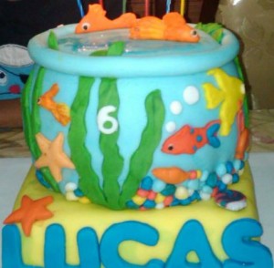 Her son's fish bowl fondant cake. One of her first cakes of such a design with all edible handmade pieces.