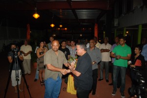 Roraima Airways' Managing Director Gerry Gouveia presents the award to Miles Williams