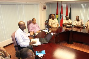 Information specialist Floyd Levi and Home Affairs Minister Clement Rohee at the launch of the website ipaidabribe.gy, along with police top brass