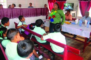 Education Minister Priya Manickchand delivering a charge to the students of the Moraikobai Primary School, Region Five, as the village begins receiving the Guyana Learning Channel