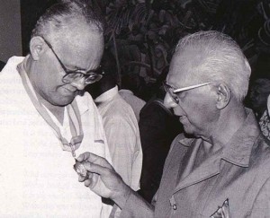 Martin Carter (left) and then President Cheddi Jagan look at the Order of Roraima medal the poet received in 1994