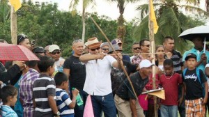 Moruca residents observe a game of archery at last year's expo