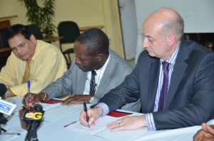 UG Vice Chancellor Dr Jacob Opadeyi and UCLan Deputy Vice Chancellor Professor Dave Phoenix signing the MoU