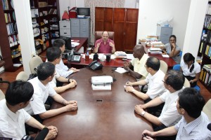 Health Minister Dr Bheri Ramsaran (centre) surrounded by the Chinese doctors