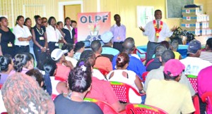 Prime Minister Samuel Hinds interacting with One Laptop Per Family (OLPF) beneficiaries from Goedverwagting and its environs