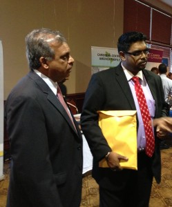 Acting Tourism, Industry and Commerce Minister Irfaan Ali listens to a delegate at the forum