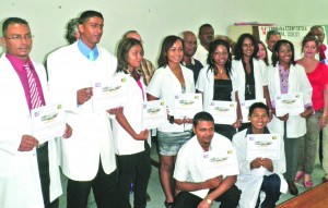 The newly-graduated doctors with Cuban and regional officials at the Suddie Hospital