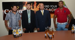 From left: Ramnaresh Sarwan, Guyana Amazon Warriors captain; Ravie Ramcharitar, director, Guyana Amazon Warriors franchise; Wayne James, managing director, Top Brandz Distributors (distributors of Corona beer); and Christopher Barnwell, team member, Guyana Amazon Warriors