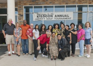 Dhaman Kissoon, first from left in front row, with his mother, seated, and other family members and friends