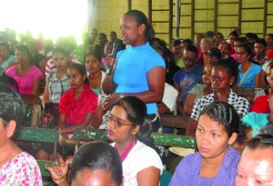 A teacher raising her concerns at the meeting with Education Minister Priya Manickchand