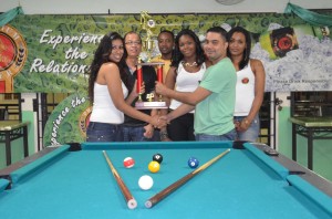 Ryan Rambalak (right) receives the first prize trophy from a Premium Beer model while Premium Beer managers Brian Choo-Hen and Jeoff Clement, and other models look on