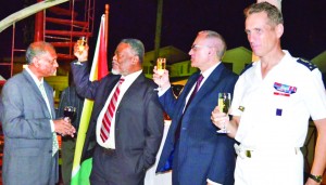 Prime Minister Samuel Hinds, French Ambassador Joel Godeau, acting Foreign Affairs Minister Dr Leslie Ramsammy and Major General of the French Guiana Armed Forces, Bernard Metz making a toast in observance of France’s National Day