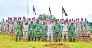 U.S. military cadets and members of the Guyana Defence Force pose for a group photo at the end of the training at the Colonel Robert Mitchell Jungle and Amphibious Training School