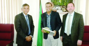 Natural Resources and Environment Minister Robert Persaud with U.S. Embassy Economic and Commercial Officer Jeffrey Barrus (right) and Dr Janaki Alavalapati, Senior Fellow with the Energy and Climate Partnership of Americas (ECPA) 