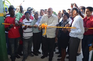 President Donald Ramotar cutting the ribbon to commission Guyana’s first bioethanol demonstration plant on Tuesday at the Albion Sugar Factory