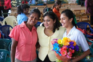 Maria and her mom share a photo with Education Minister Priya Manikchand (MOE photo) 