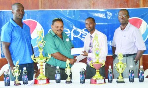 DDL Pepsi Brand Executive Larry Wills hands over the sponsorship package to GCB President Drubahadur. Chairman of the GCB’S competition committee Colin Europe (right) and Chairman of the GCB’s senior selection panel Rayon Griffith look on (Rajiv Bisnauth photo)