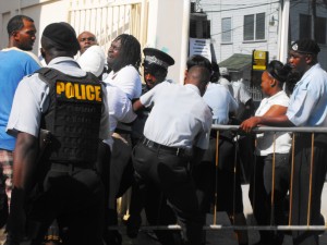 One of the suspects resisting police officers