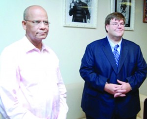 U.S. embassy Deputy Chief of Mission Bryan Hunt and Home Affairs Minister Clement Rohee