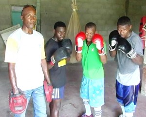 From left to right Coach Jeff Roberts, Joel Williamson, Travis Fraser and Michael April at the gym