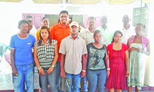 Housing Minister Irfaan Ali with some of the house lot recipients during the One Stop Shop exercise in Region Two last week