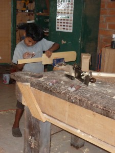 Little Ezekiel sanding his bat