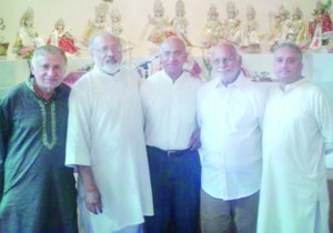 Pandit Bankim Gossai (second left) with worshippers at the Maha Lakshmi Vidya Bhavan Mandir