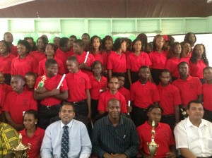 Culture, Youth and Sport Minister Dr Frank Anthony, Permanent Secretary Alfred King and Assistant Youth Director Devanand Ramdat with the Sophia Training Centre 2013 graduating class