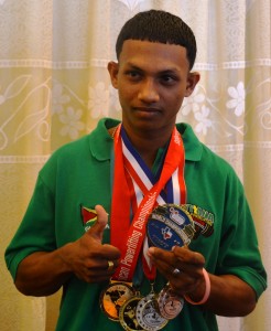 Fully loaded! Gumendra Shewdas displays his gold medal as well as other medals won from previous championships