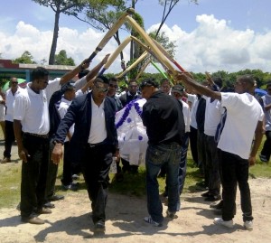 Members of the Cotton Field Wild Oats softball team and Reliance Sports Club form a guard of honour as they pay their last respects to their late teammate, Shivanandan Madholall (Photo: Avenash Ramzan)