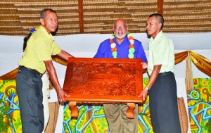 The National Toshao Council presenting a handcrafted table to President Donald Ramotar