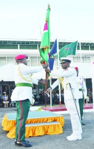 Outgoing Chief-of-Staff Rear Admiral Gary Best hands over the ‘Force Colours’ to his successor Brigadier Mark Phillips