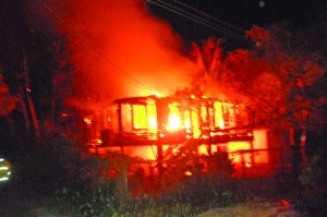 The blazing house at Islington, New Amsterdam, Berbice, which took the life of an elderly woman after her sister was rescued by a neighbour