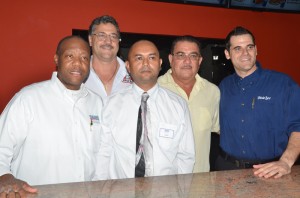 704 Food and Entertainment Bar Owner Alfro Alphonso and Chief Operations Manager Kurt Taylor with managers of the three outlets