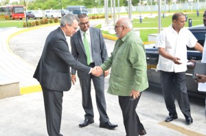 President Donald Ramotar greeting FAO Assistant Director General Edurado Rojas in the presence of Natural Resources and the Environment Minister Robert Persaud